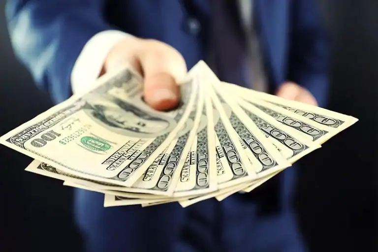 An image of money, showing how to secure funding and find self storage investors.